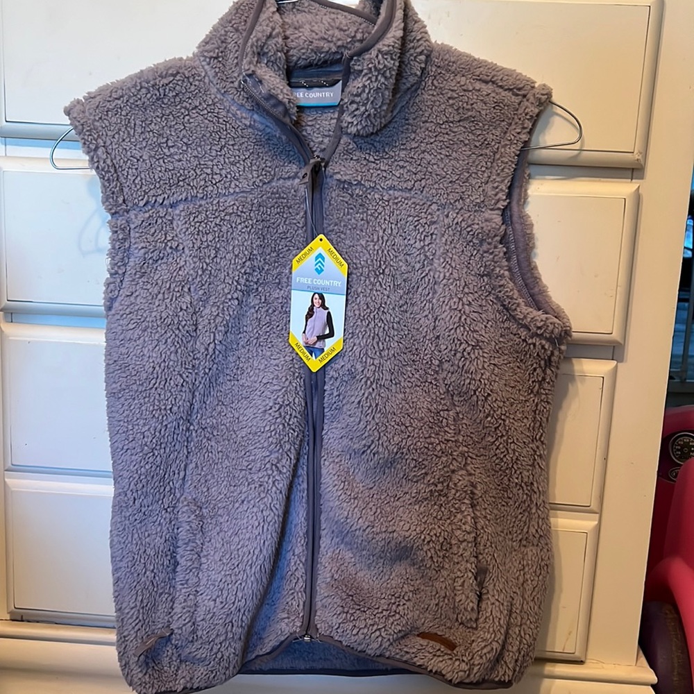 New, super soft, Free Country plush vest. Tags intact. Size medium.